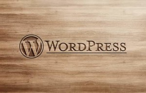 wordpress name and logo carved into wood board